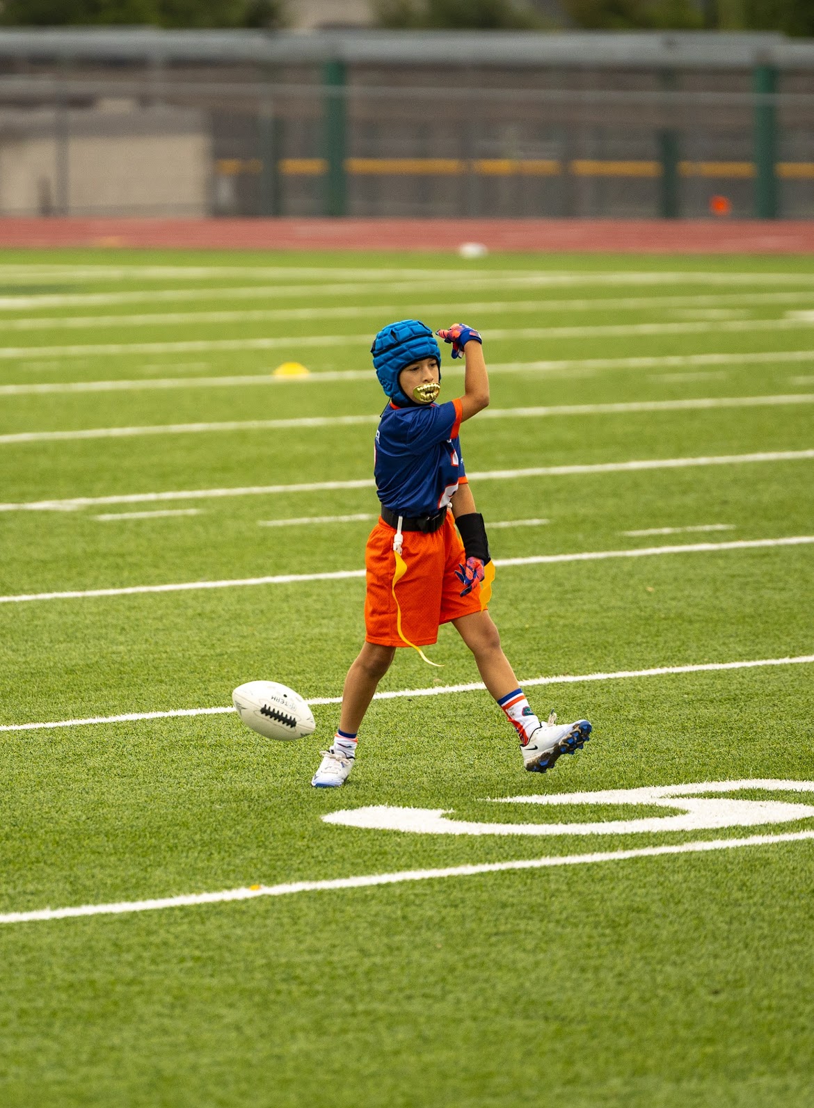 Player throwing a football downfield